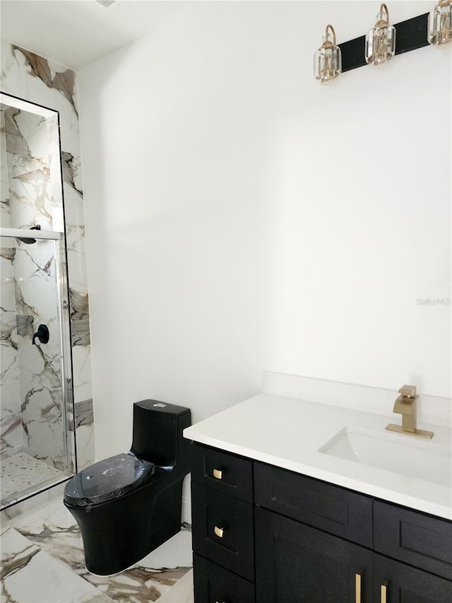 bathroom featuring vanity, toilet, and a shower with shower door