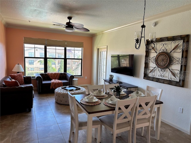 dining area with a textured ceiling, ornamental molding, and a wealth of natural light