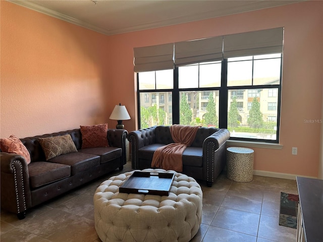 living room featuring ornamental molding, a healthy amount of sunlight, and tile patterned flooring