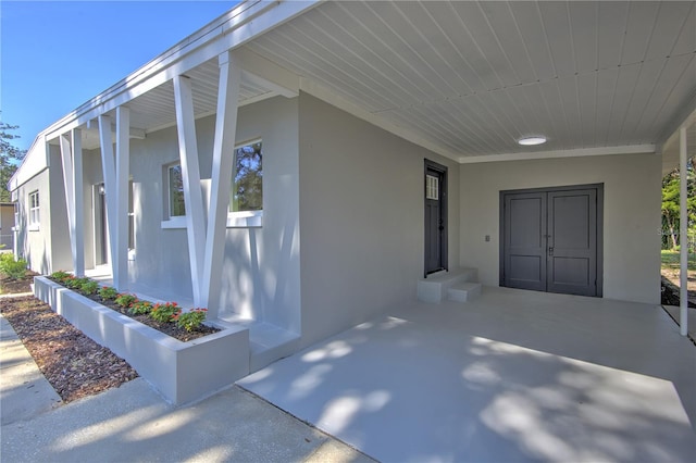 property entrance with a porch