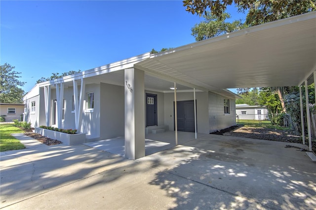 exterior space featuring a carport