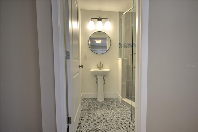 bathroom featuring an enclosed shower and tile patterned flooring