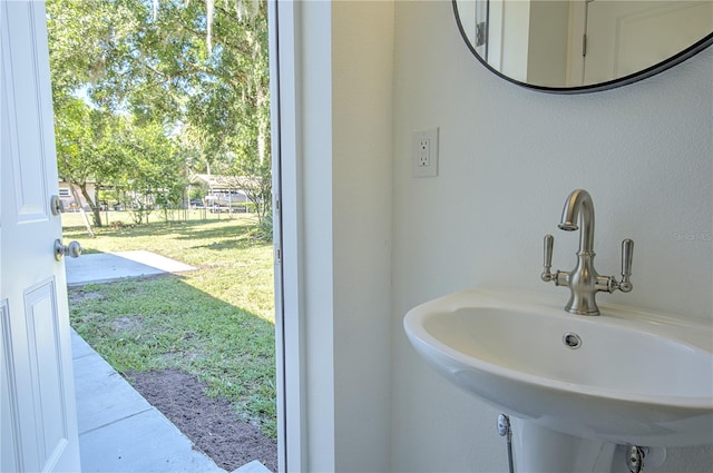 bathroom featuring a healthy amount of sunlight and sink