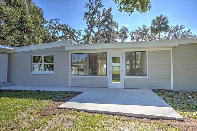 rear view of property with a patio area