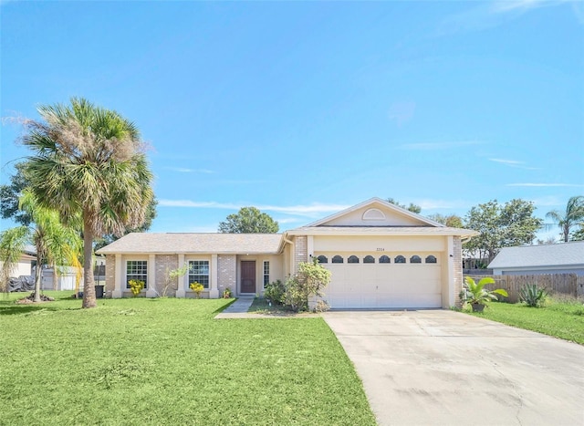 single story home featuring a front yard and a garage