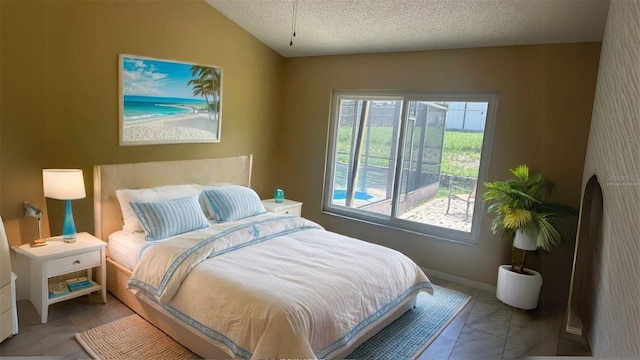 2204 Clementine Trl, Clermont, FL 34714 - bedroom featuring a textured ceiling and vaulted ceiling