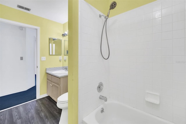 2204 Clementine Trl, Clermont, FL 34714 - bathroom with vanity, wood finished floors, bathtub / shower combination, and toilet