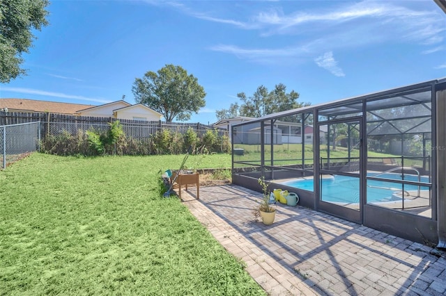 2204 Clementine Trl, Clermont, FL 34714 - view of yard featuring a patio and glass enclosure