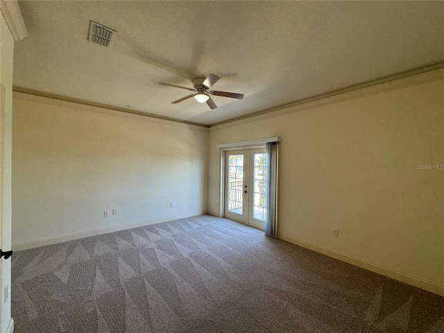 unfurnished room featuring french doors, carpet flooring, and ornamental molding