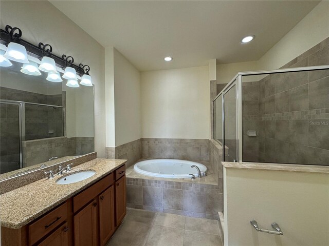 bathroom featuring vanity, separate shower and tub, and tile patterned floors