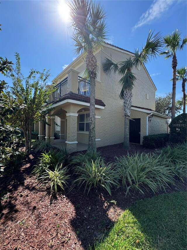 view of property exterior with a balcony