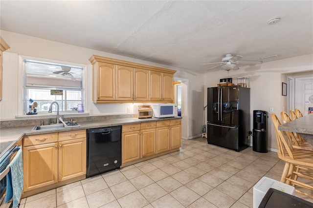 kitchen with ceiling fan, black appliances, sink, and light tile patterned floors