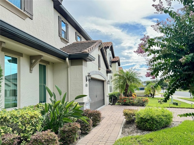 view of property exterior featuring a garage