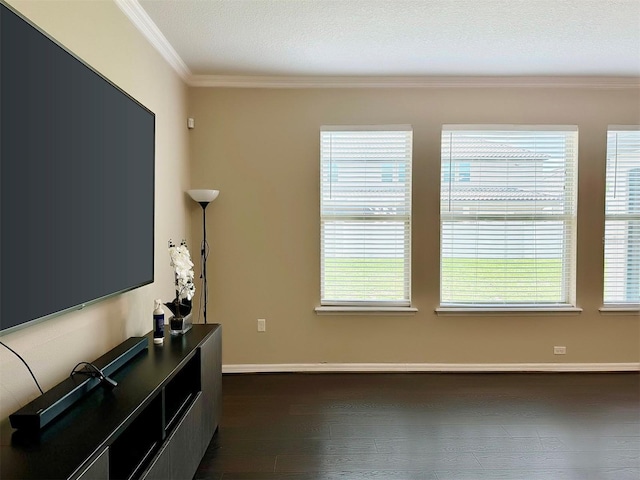 living room with a textured ceiling, a wealth of natural light, crown molding, and dark hardwood / wood-style floors