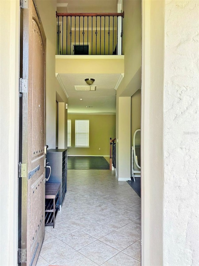 hall with light tile patterned flooring