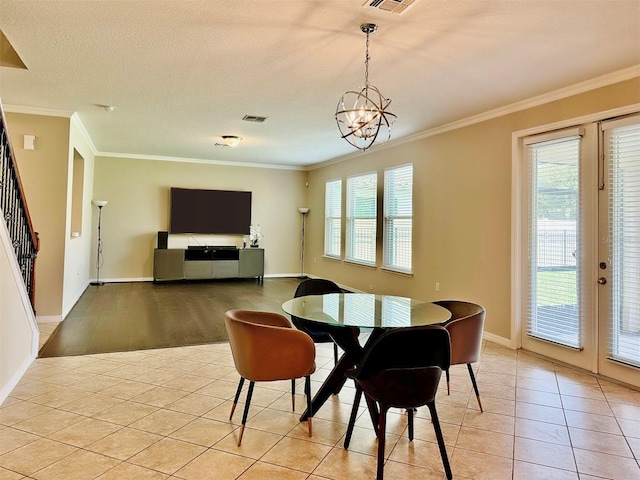 dining area with ornamental molding and a healthy amount of sunlight