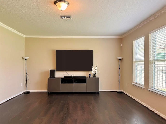 living room with plenty of natural light, dark wood-type flooring, and a textured ceiling