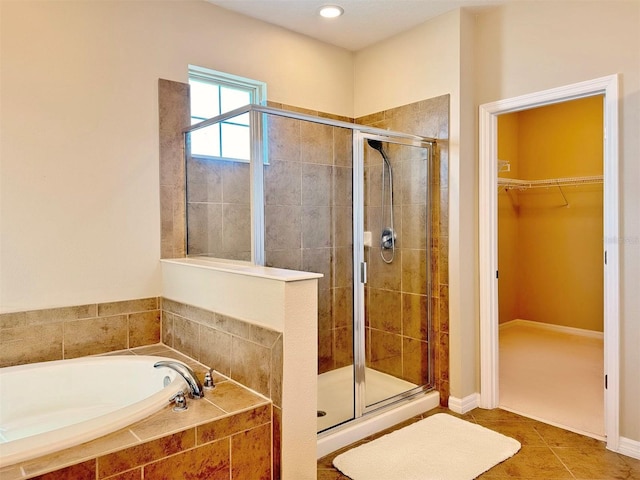 bathroom featuring tile patterned floors and plus walk in shower