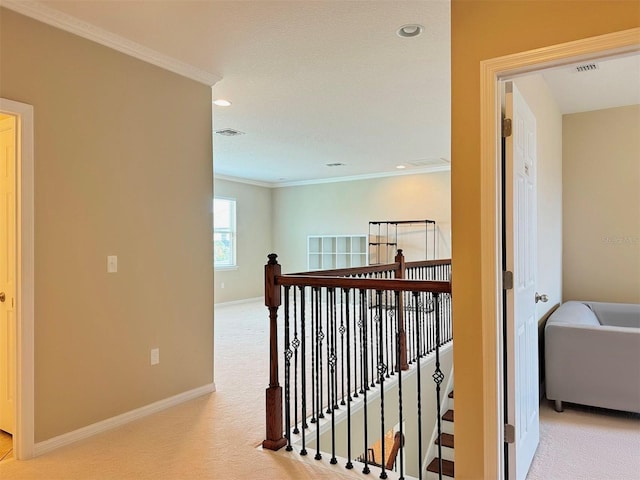 hallway with light colored carpet and ornamental molding