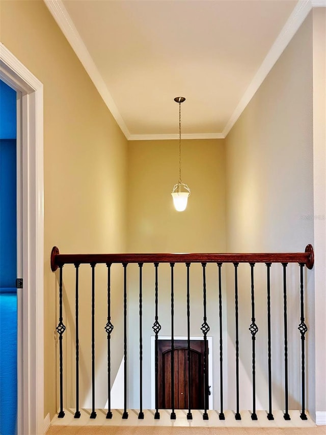 stairs featuring carpet flooring and ornamental molding