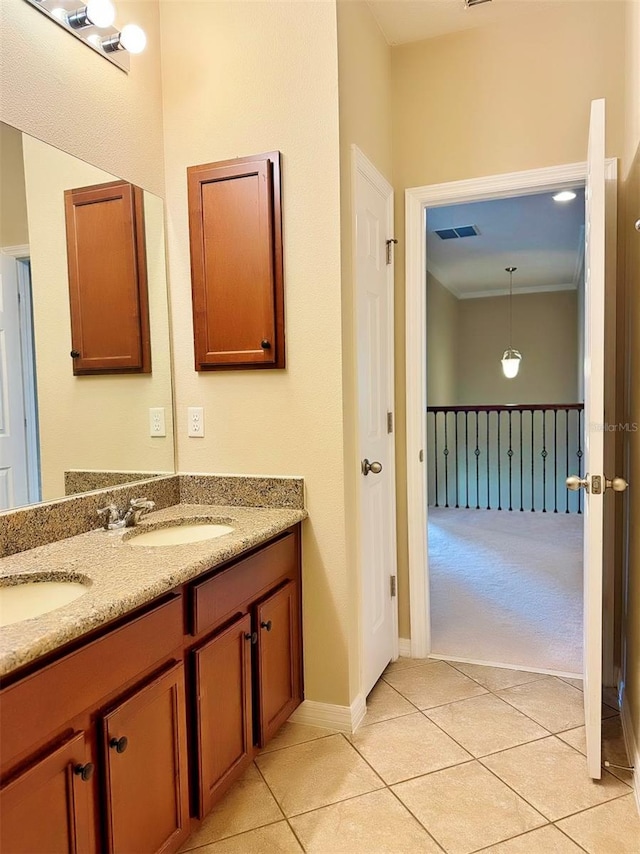 bathroom with tile patterned flooring and vanity