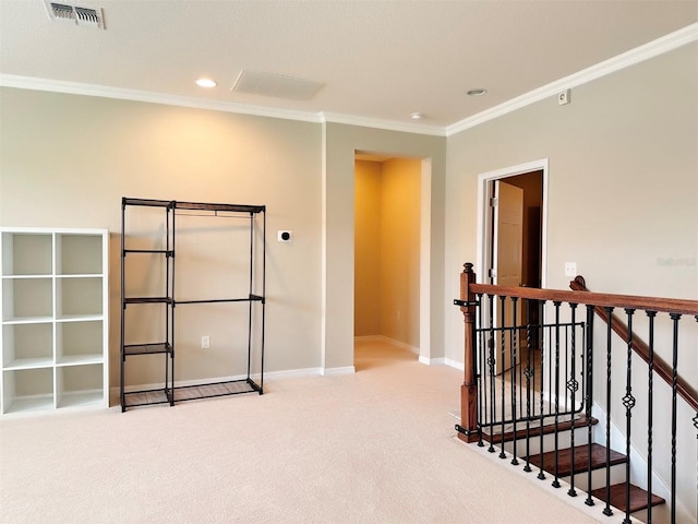 interior space with light colored carpet, ornamental molding, and a textured ceiling