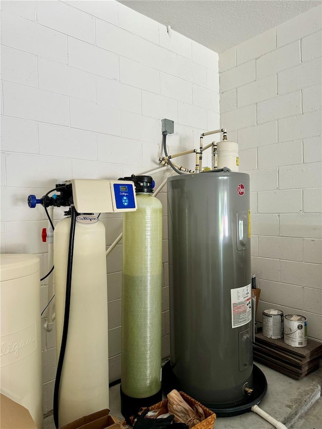 utility room featuring water heater