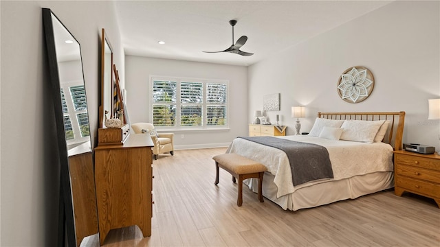 bedroom with baseboards, recessed lighting, ceiling fan, and light wood-style flooring