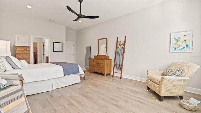 bedroom featuring recessed lighting, baseboards, and light wood-type flooring
