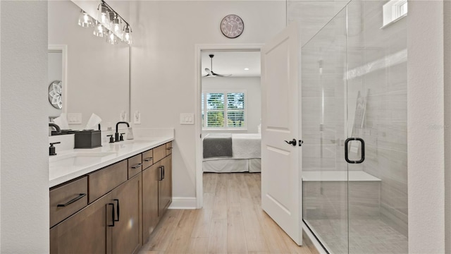 bathroom featuring vanity, hardwood / wood-style floors, and an enclosed shower