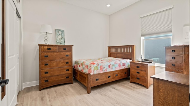 bedroom with recessed lighting, light wood-style flooring, and baseboards