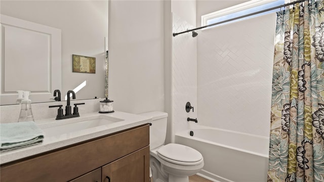 full bathroom featuring vanity, shower / tub combo, and toilet