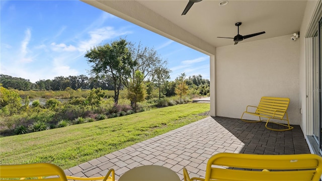 view of patio / terrace featuring ceiling fan