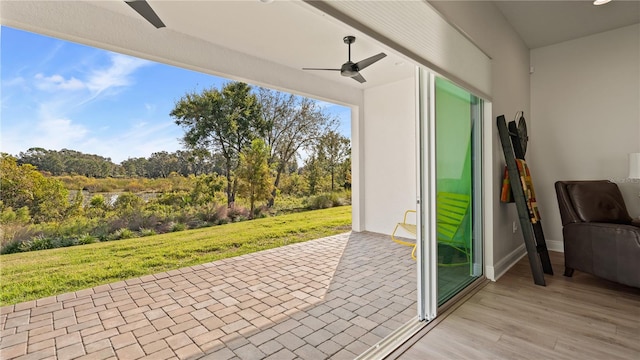 exterior space featuring ceiling fan