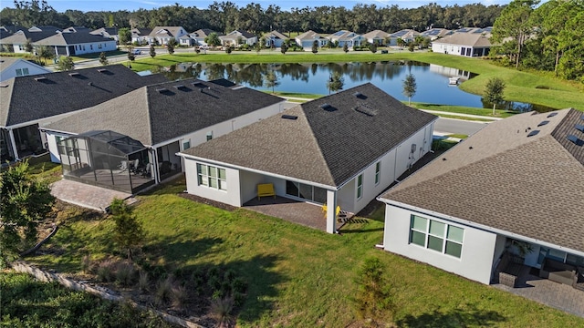 birds eye view of property with a residential view and a water view