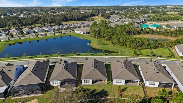 birds eye view of property featuring a water view and a residential view