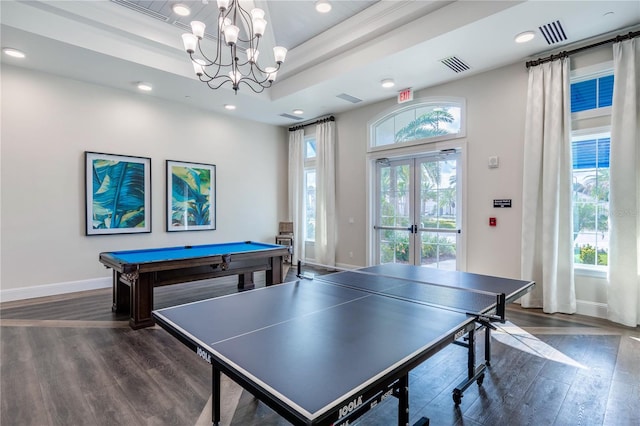 rec room with dark wood-type flooring, french doors, a notable chandelier, and baseboards