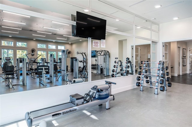 gym featuring recessed lighting and baseboards