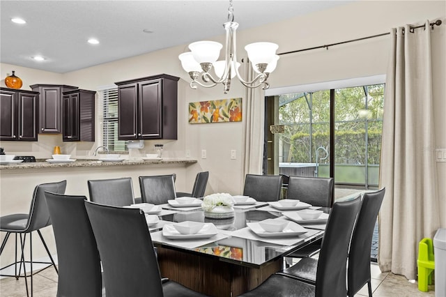 1473 Moon Valley Dr, Davenport, FL 33896 - dining space with a chandelier, light tile patterned floors, and recessed lighting