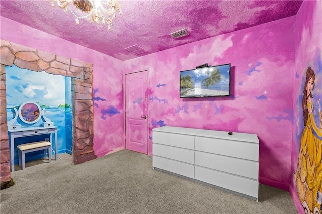 1473 Moon Valley Dr, Davenport, FL 33896 - bedroom featuring carpet flooring, a textured ceiling, and a chandelier