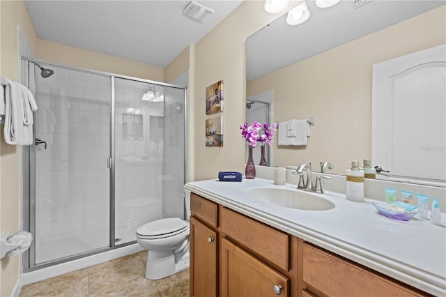 1473 Moon Valley Dr, Davenport, FL 33896 - bathroom featuring vanity, a shower stall, toilet, and tile patterned flooring
