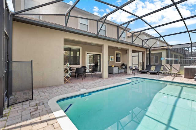 view of pool featuring a lanai, a patio area, and an outdoor living space