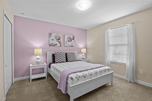1473 Moon Valley Dr, Davenport, FL 33896 - carpeted bedroom with a textured ceiling and baseboards