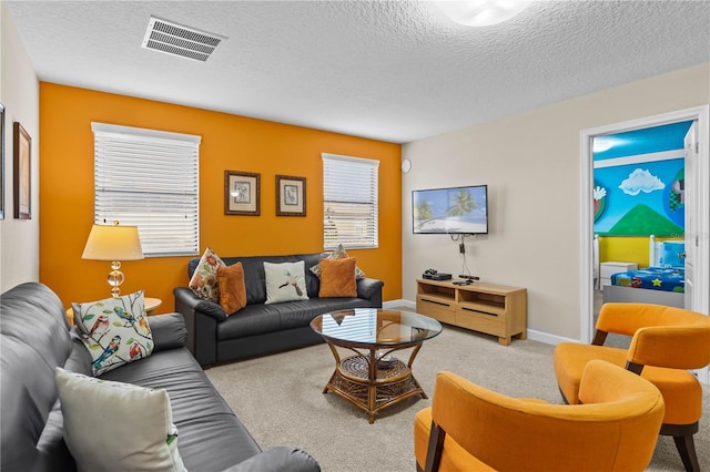 1473 Moon Valley Dr, Davenport, FL 33896 - carpeted living room featuring a textured ceiling