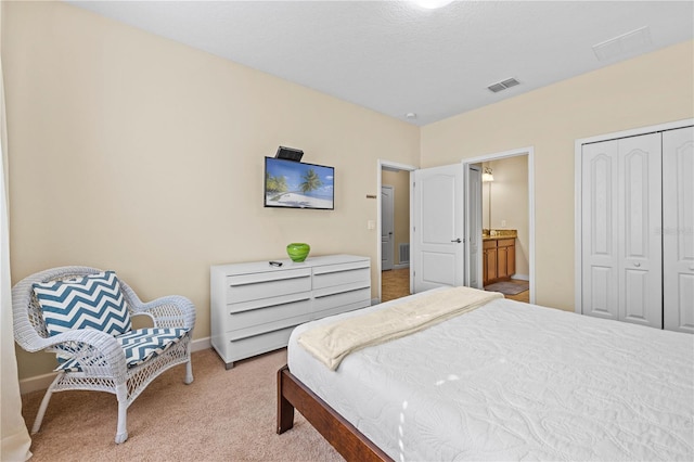 1473 Moon Valley Dr, Davenport, FL 33896 - bedroom with light carpet, baseboards, a closet, and connected bathroom