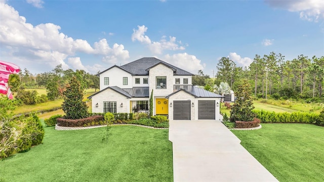 view of front of home featuring a garage and a front lawn