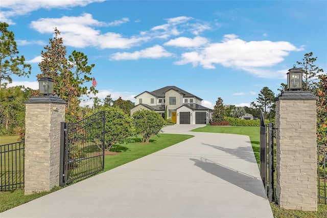 view of gate with a yard and a garage