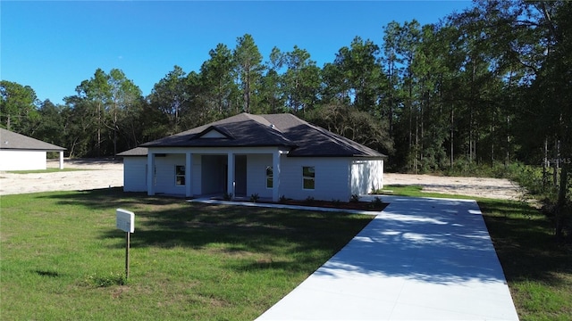 view of front of home with a front lawn and a porch