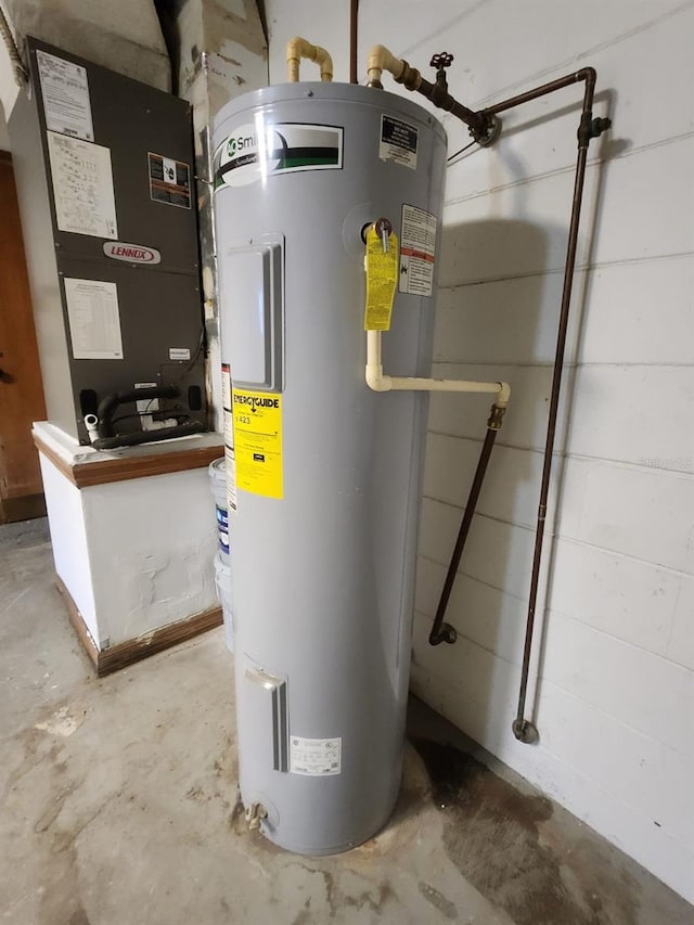 utility room with electric water heater and heating unit