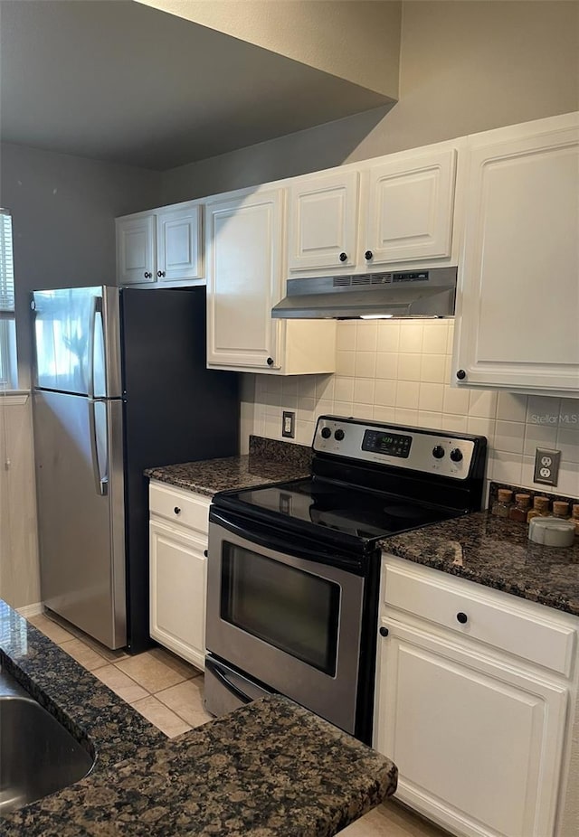 413 Summit Ridge Pl Unit 209, Longwood, FL 32779 - kitchen with stainless steel appliances, under cabinet range hood, decorative backsplash, white cabinets, and light tile patterned flooring